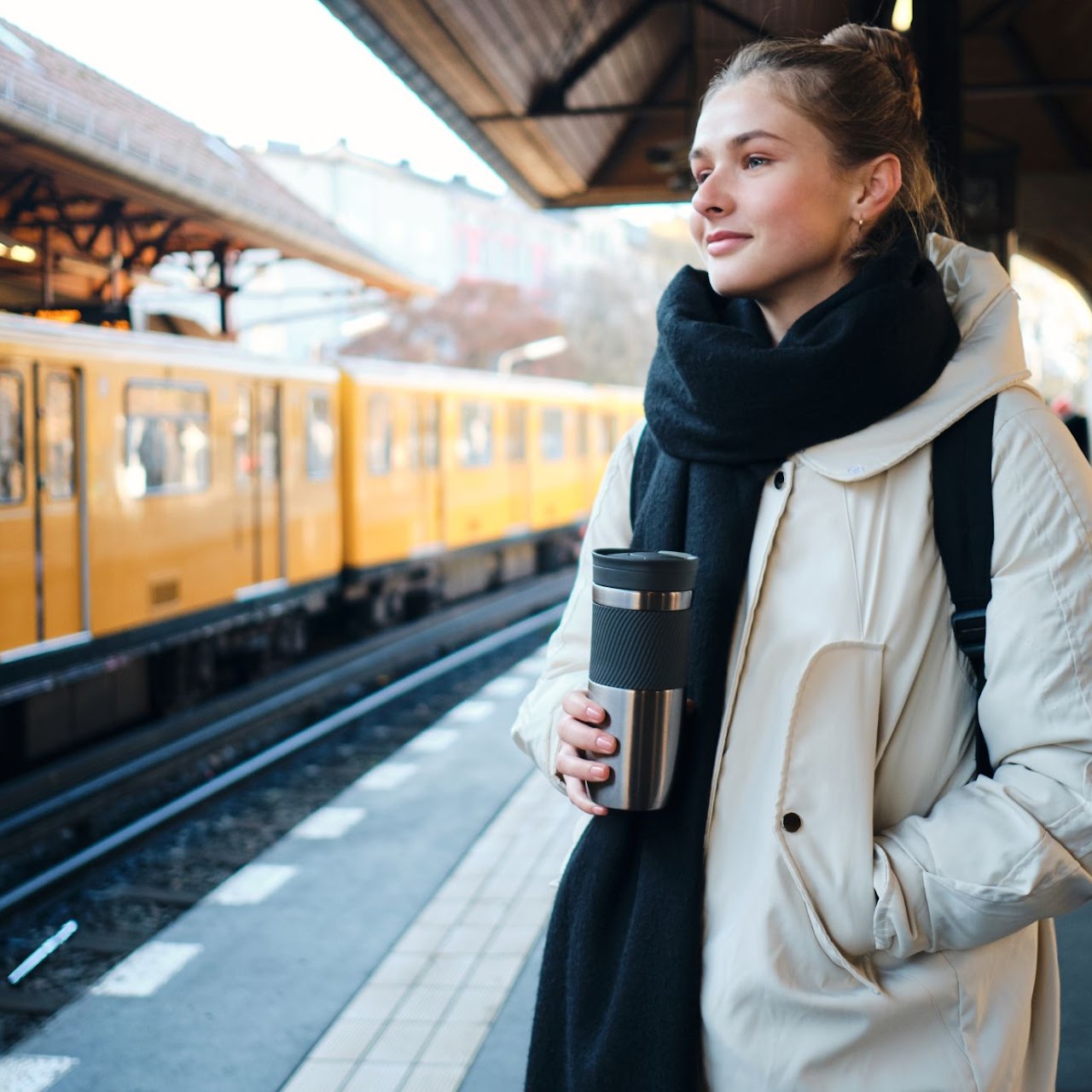 pretty-casual-tourist-girl-happily-standing-platform-waiting-train-metro-station